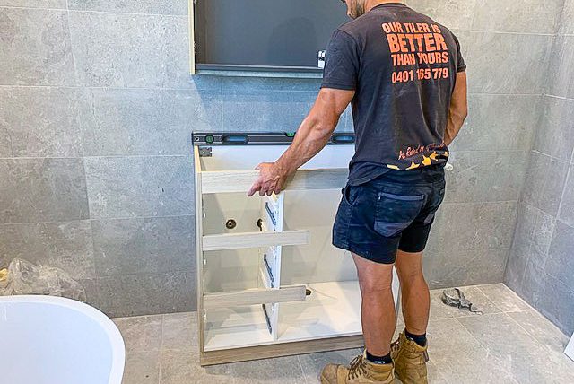 Small Bathroom Renovations in the Eastern Suburbs by Nu Trend installing the vanity